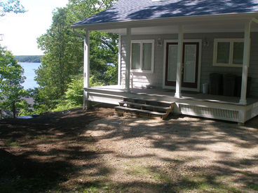 Approaching the cottage from the driveway with ocean off to the left