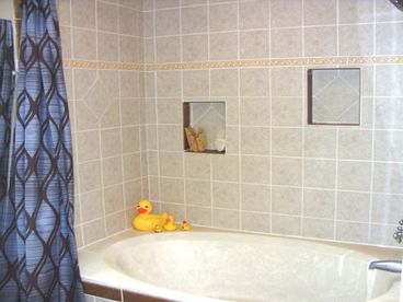 Master bath with soaking tub , rain showerhead and skylight