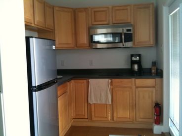 Efficiency kitchen with 2 burner cooktop and microwave/convection combo oven.