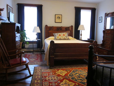 Bedroom with antique queen bed and daybed