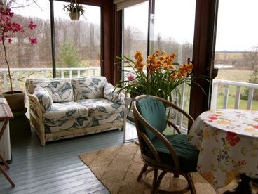 Sun room with tree-top view of farm, gardens, pond and distant mountains