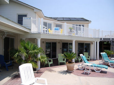 after a sun-filled day at the beach or pool relax under the large covered lanai areas