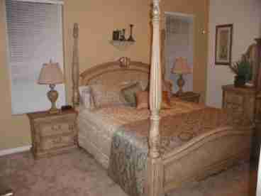 Beautiful four poster bed and premium furnishings in the main Master Bedroom.  This master bedroom also has, cable TV and DVD, a large bathroom and patio doors to the pool.
