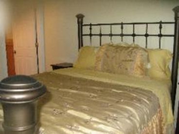 Master bedroom with Queen bed and en suite bathroom with shower (no tub).