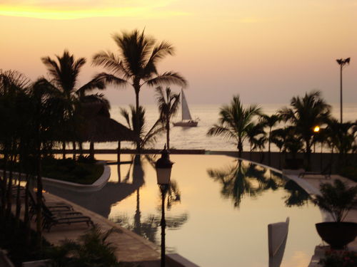 view from the Deck, overlooking the pool and a nice ocean vie