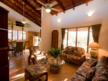 This is the living area with the dining area and kitchen in the background.