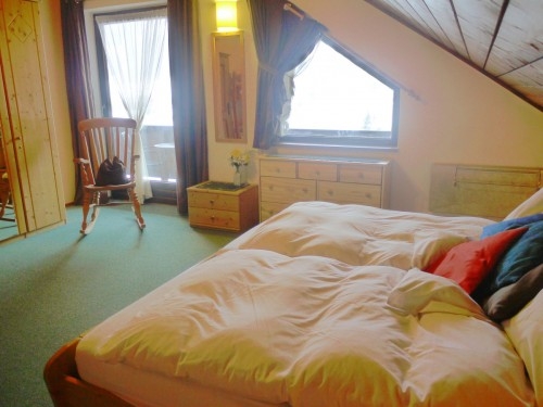 Lovely bedroom with double bed and bunk beds and with access to the balcony.