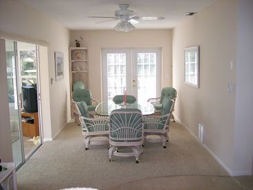 Dining Room with access to deck and patio. Dining Room has Cable TV