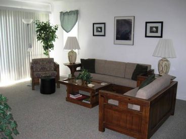 Living Room with Access to Oceanfront Porch with amazing views!