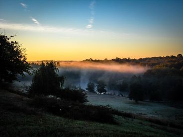 Morning mist over Le Manoir\'s hidden valley
