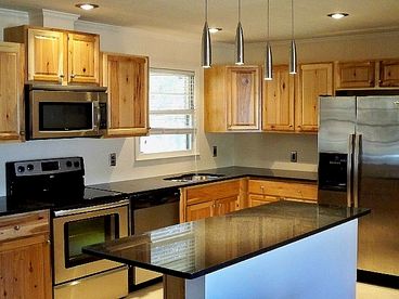 Did not even have a faucet when this photo was taken in early April.  Beautiful granite counters, new appliances, clean, clean, clean.