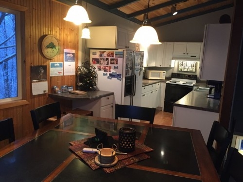 Gathering table with eight chairs, computer nook and fully-stocked kitchen. Just bring your food!