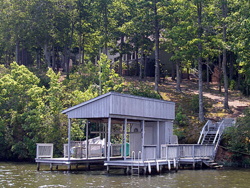Relax and hang out on the boat house with chairs for sunning and deep water dock for swimming.  Shoreline in front of the house is great for floating and enjoying the natural beauty of the rocks and trees.  VERY PRIVATE!