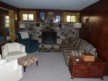 Livingroom with sofa sleeper and fireplace.