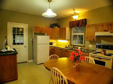 The eat-in kitchen is equipped with a full size fridge/freezer, stove/oven, microwave, toaster, kettle and coffee-maker. Complimentary coffee and tea provided.