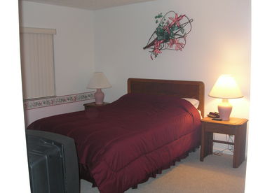 Master bedroom has a queen bed, an attached master bathroom, two closets , and  a TV in it. 
