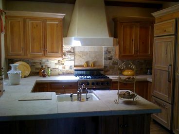 Gourmet kitchen with distressed limestone counters, 6 burner Viking range and oven, dishwasher, disposal, water purification system