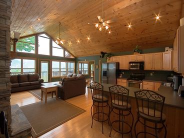 Great Room of Gatlinburg cabin with cathedral ceiling, wall of windows, big-screen HD TV, etc.