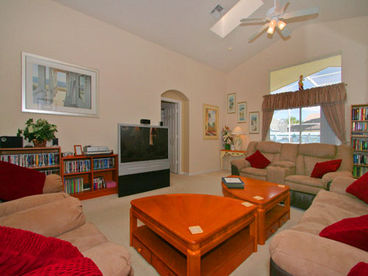 Spacious family room with 52 inch HDTV and plenty of sumptuous seating for everyone.