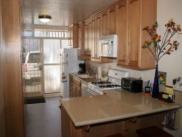 Appliances, storage and reserved parking space.