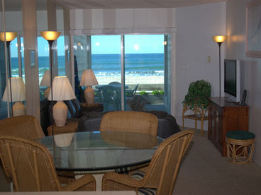 Large glass dining table, couch, loveseat, entertainment center, flat screen television, deck and ocean!