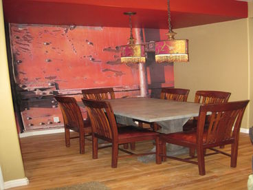 Zinc top dining table for 6.  Island in kitchen with 4 barstools