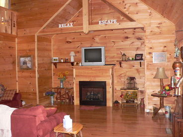 Large Living Room open area with gas log fireplace, satellite TV
Lots of natural light