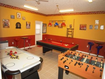The game room is fully air-conditioned and has a pool table, air hockey, foosball and large screen TV.