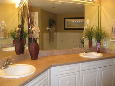 Master bath with double vanity and jacuzzi tub with seperate shower.