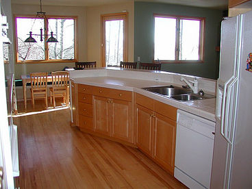 Fully Equipped Kitchen Looking into Breakfast Area