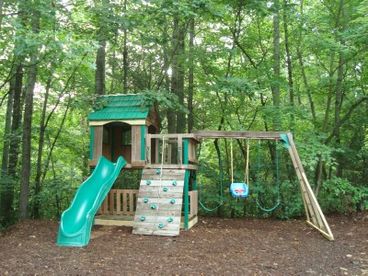 Playground with Fort, Slide, Swings, Climbing Wall.  Also a 14\' above ground pool is there and a small sunbathing deck.