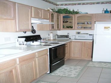 The kitchen is fully equipped with full size stove and refrigerator as well as microwave and coffee pot.