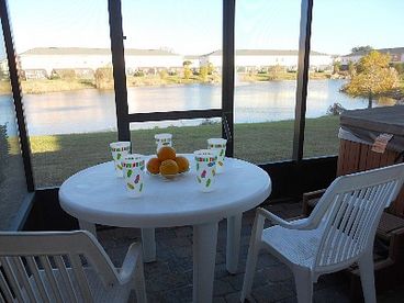 screened patio with private hot tub