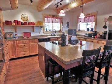 Main Level Fully Equipped Kitchen with island JenAir Stovetop and Double Ovens