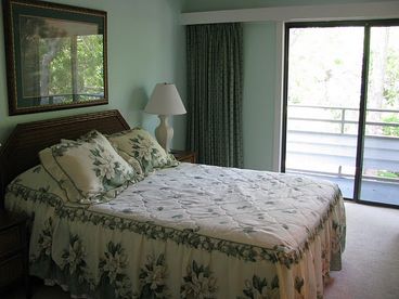 Master Bedroom W/ Queen Bed and Balcony Overlooking Pool