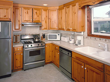 Kitchen with modern stainless steel appliances.