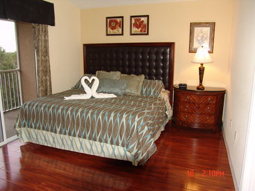 master bedroom suite with king bed and inside bathroom