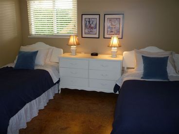 There are 2 comfortable twin beds in this room, with another closet area.  The room overlooks the backyard and pool area.