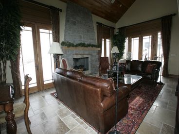 Living Room with Leather Sofas - Stone Fireplace - Plasma TV