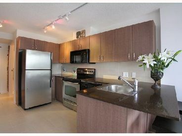 Stainless steel appliances in modern kitchen