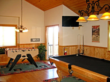 Pool table, Foosball table, 2 flat screen TV\'s and more