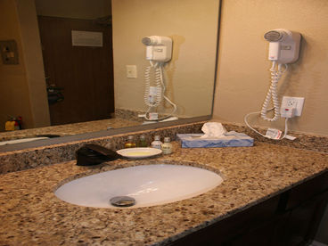 Private Bathroom
Each room has a private bathroom with separate full sink and cabinet area for efficient ready getting!  We provide a hair dryer, iron, ironing board, towels, linens, tissue, as well as travel-sized lotions, soaps, and shampoo/conditioners!
