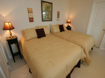 Master bedroom with 2 full beds from Bonita Beach & Tennis #1402