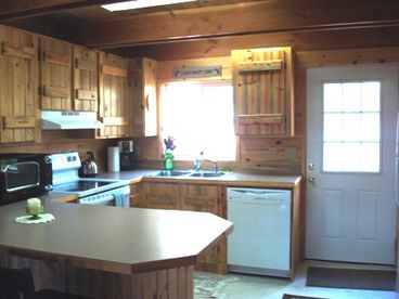 Blue Knotty Pine throughout chalet.  Kitchen is fully equipped for the vacationer.