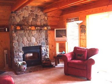 Fireplace creates a cozy centerpoint in winter.  Chalet also has forced air heating.