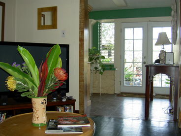 Living room looking out through french doors to our tropical garden.