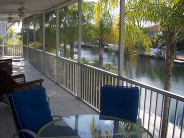 upstairs screened-in patio overlooking water