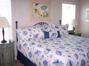 Master Bedroom with Comfy king Bed luxurious linens, Flat screen mounted TV and private full bathroom with Tile shower!