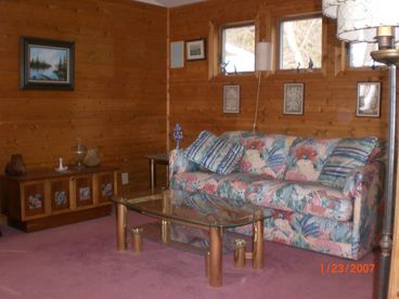 Sofa in sitting area north end of very large bedroom