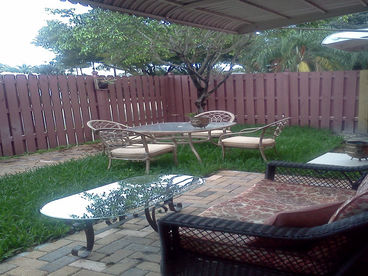 Fenced Yard great for kids & pets.  Lounge chairs, outdoor dining set, loveseat & coffee table.